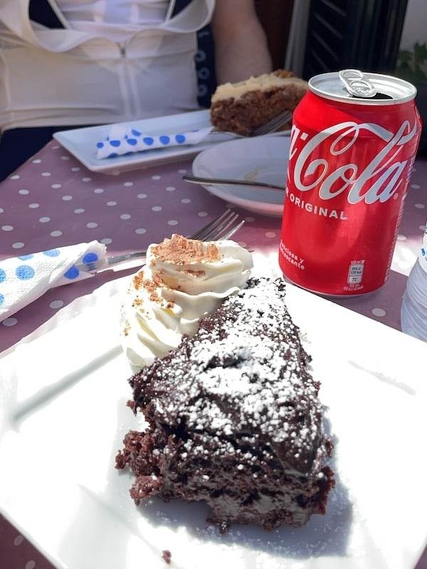 Feasting on cake and a can of coke at the Can Topaz cafe at Coll de Soller