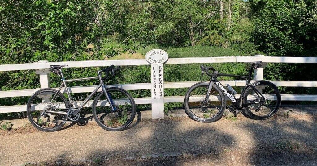 two bikes either side of a two counties sign.jpg
