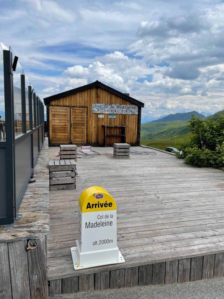the summit marker on the col de la madeleine showing arrivee