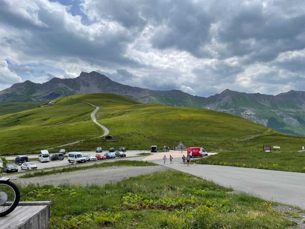 view of surrounding alpine mountains at the col de la madeleine summit