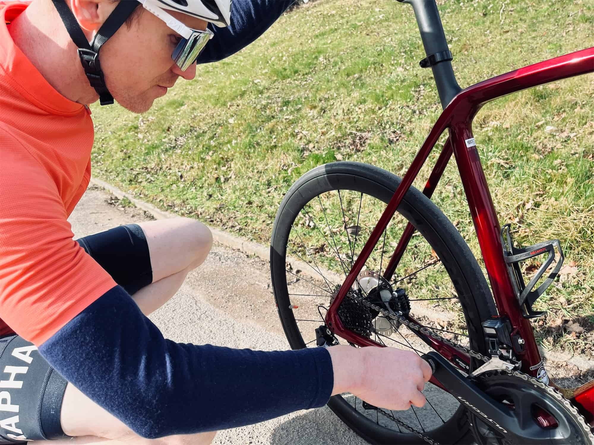 cyclist checking the bike tire