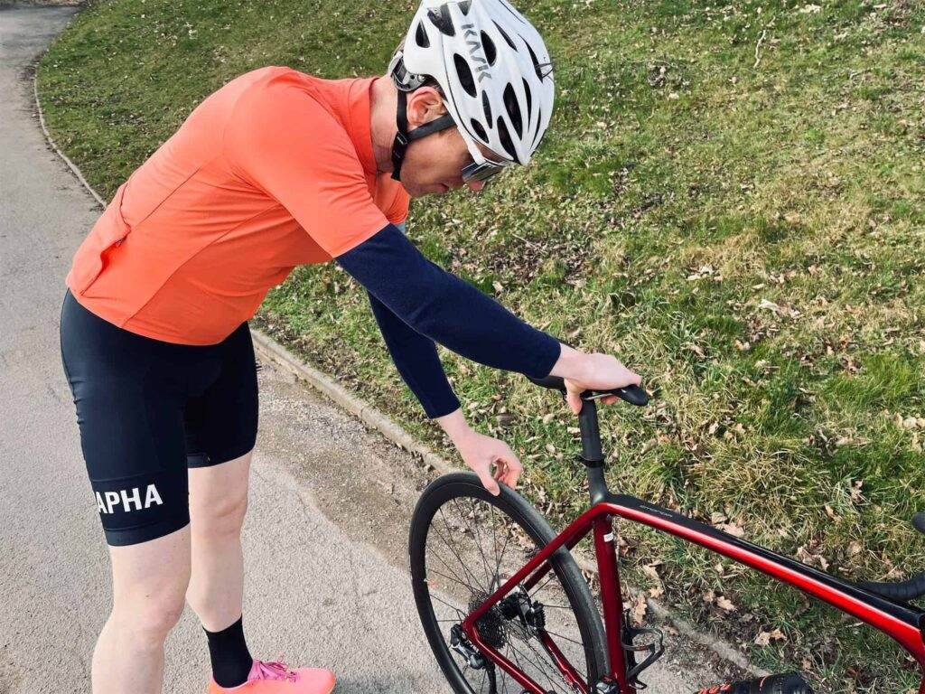 cyclist checking the bike tires