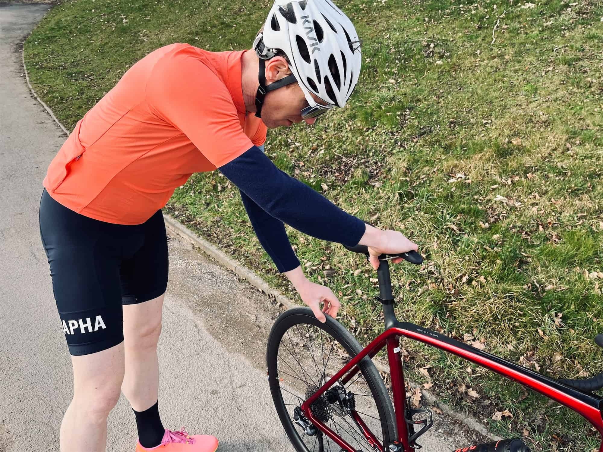 cyclist checking the bike tires