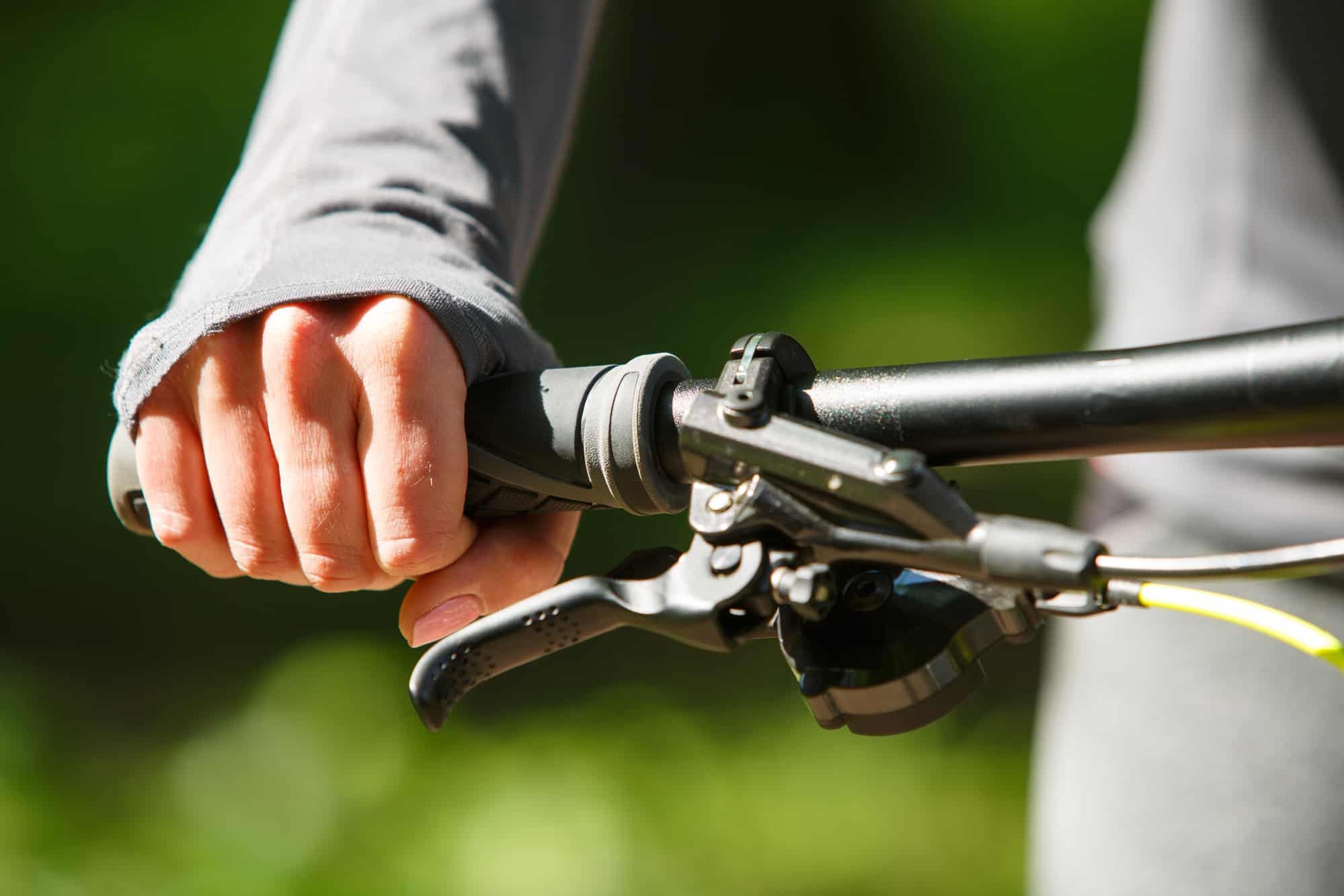 Woman cyclist holding a handlebar