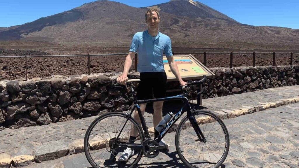 smiling road cyclist on mount teide tenerife