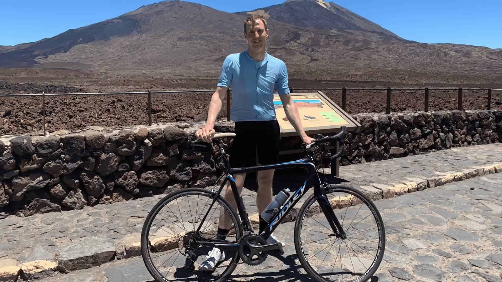 smiling road cyclist on mount teide tenerife