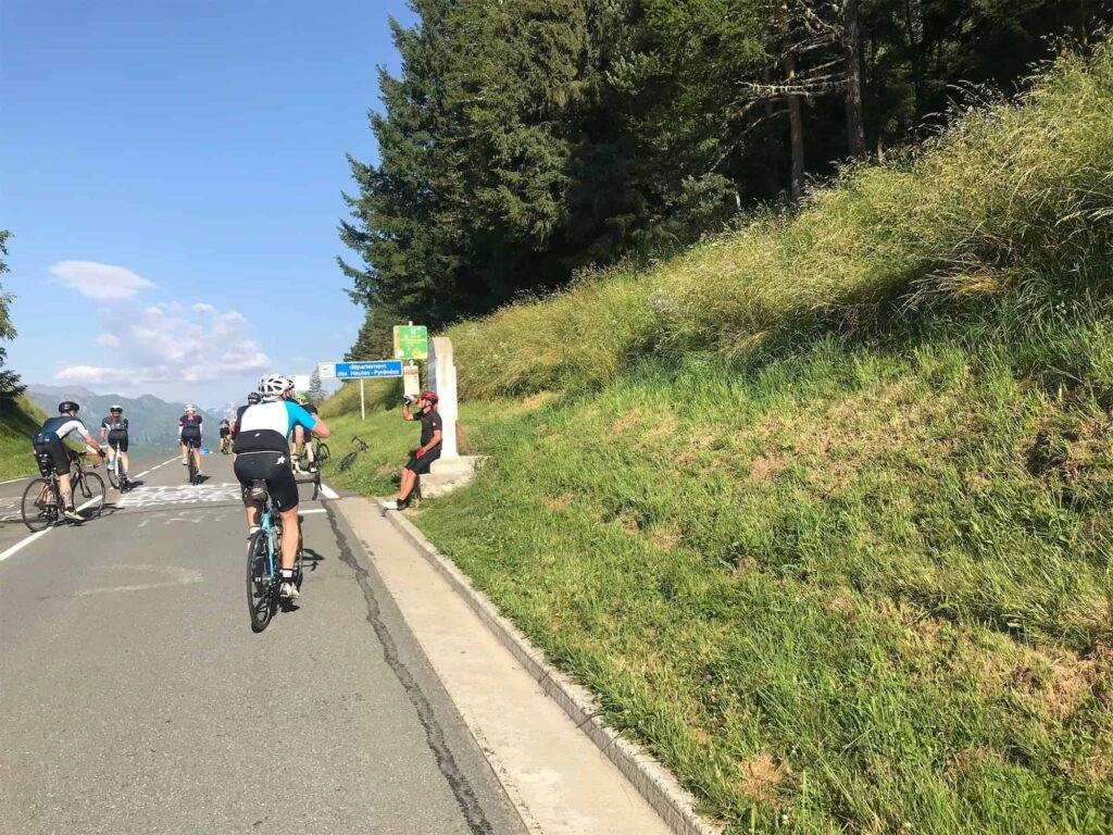 a cyclist stopping for a drink on a bike ride