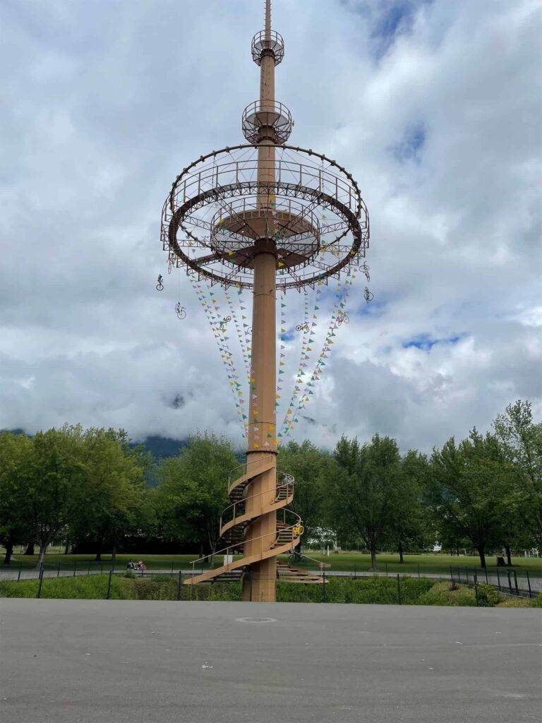 a tower in albertville decorated with bicycles