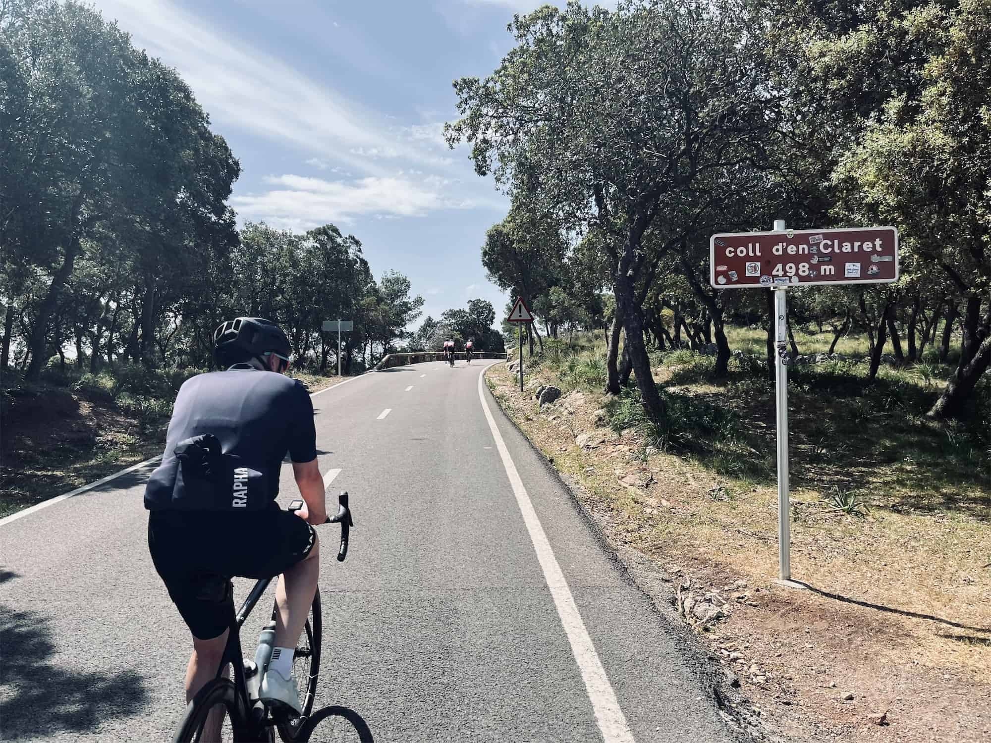 a cyclist riding up hills