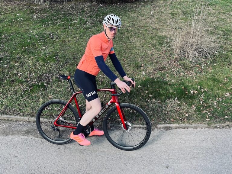 A beginner cyclist endurance training on a paved road.
