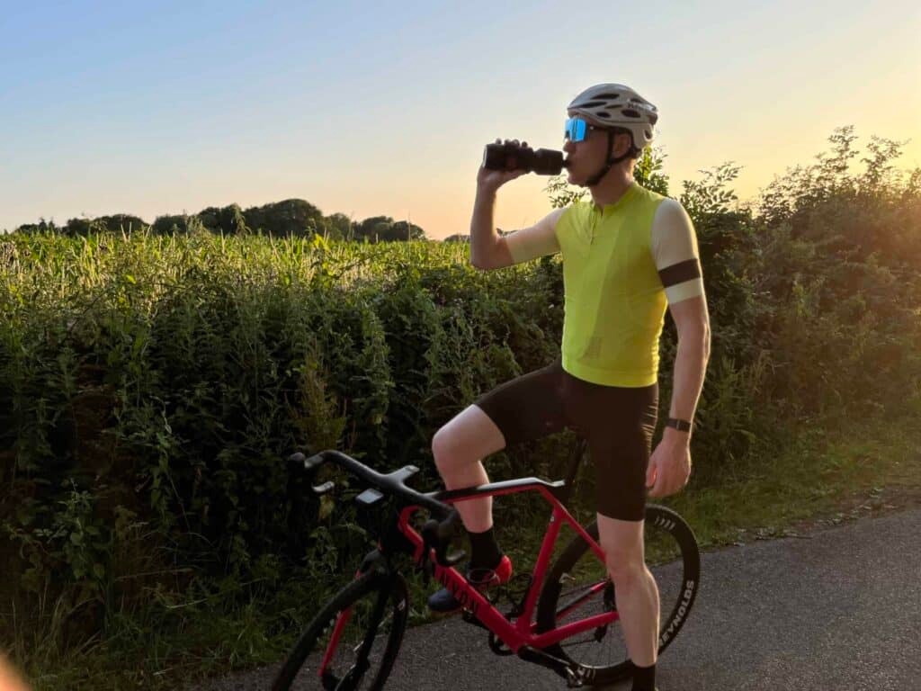 cyclist drinking water during morning ride