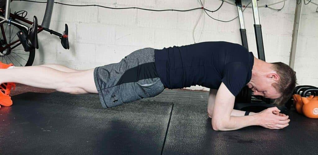 side view of cyclist planking