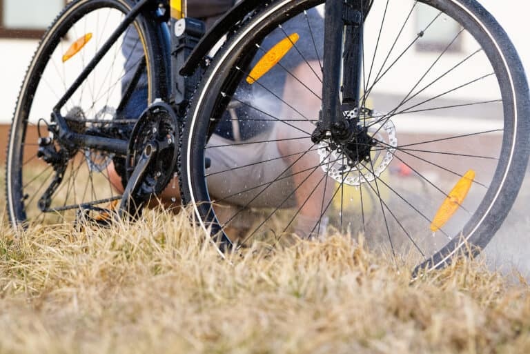 Bicycle spring wash on backyard. spring preparations for the cycling season. DIY bike care, pressure bike wash