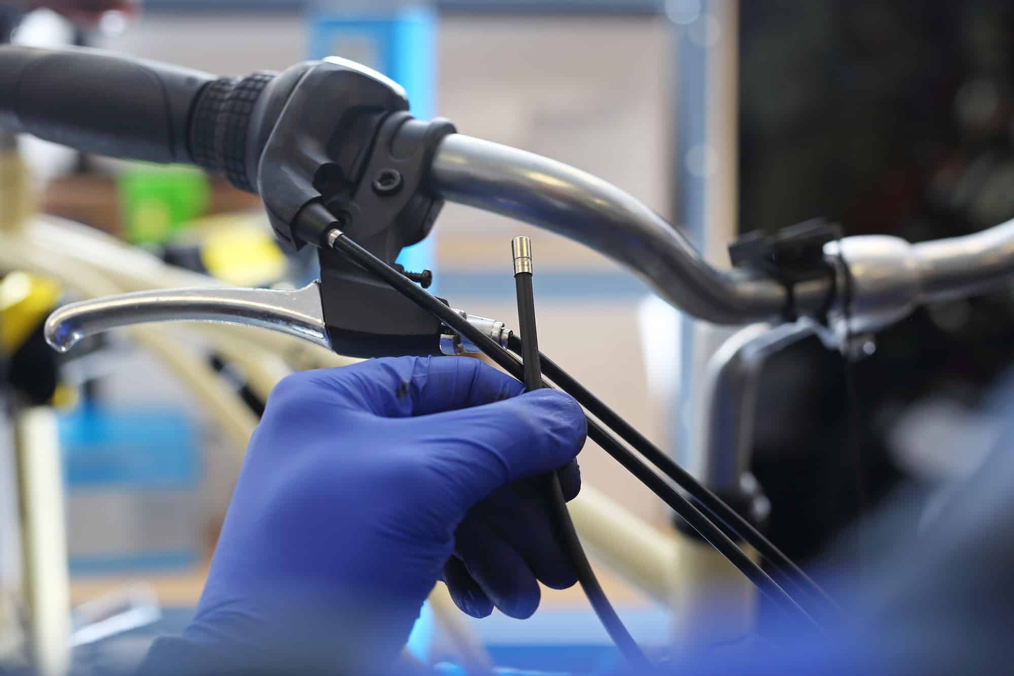 cyclist repairing the brake