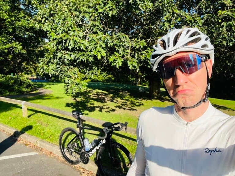 A man is taking a selfie with his bike.