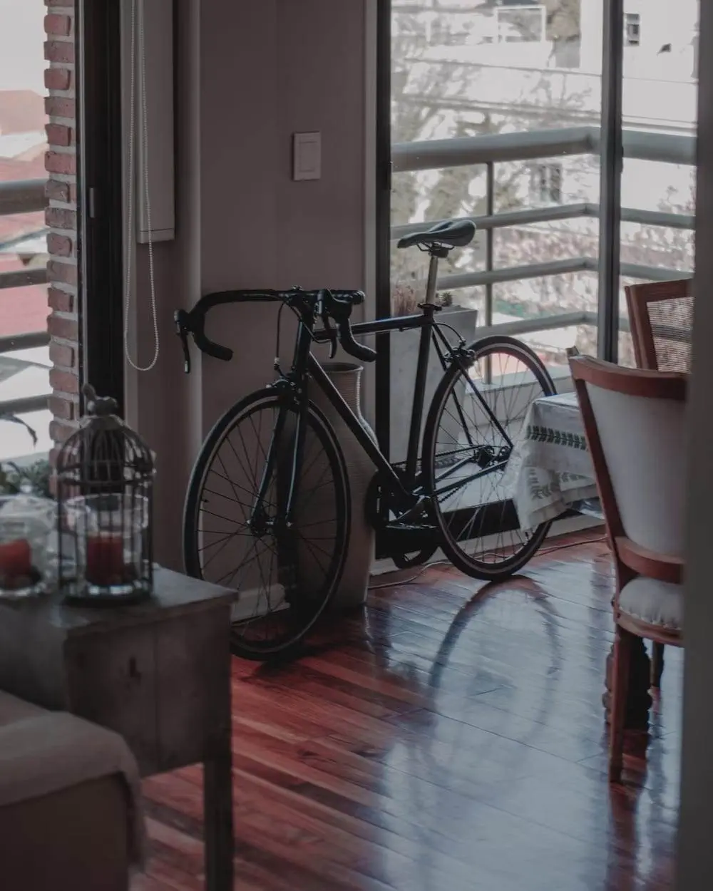 A bicycle parked inside the living room
