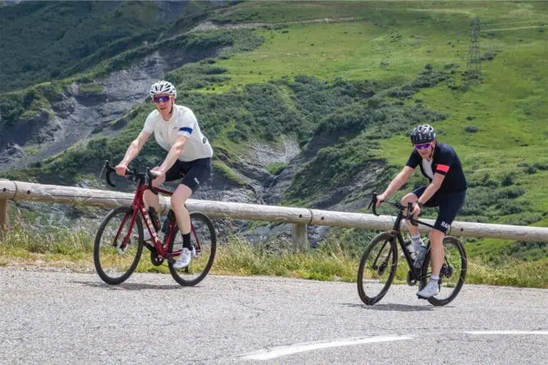 two-cyclists-nearing-the-summit-of-the-col-de-la-madeleine two cyclists nearing the summit of the col de la madeleine
