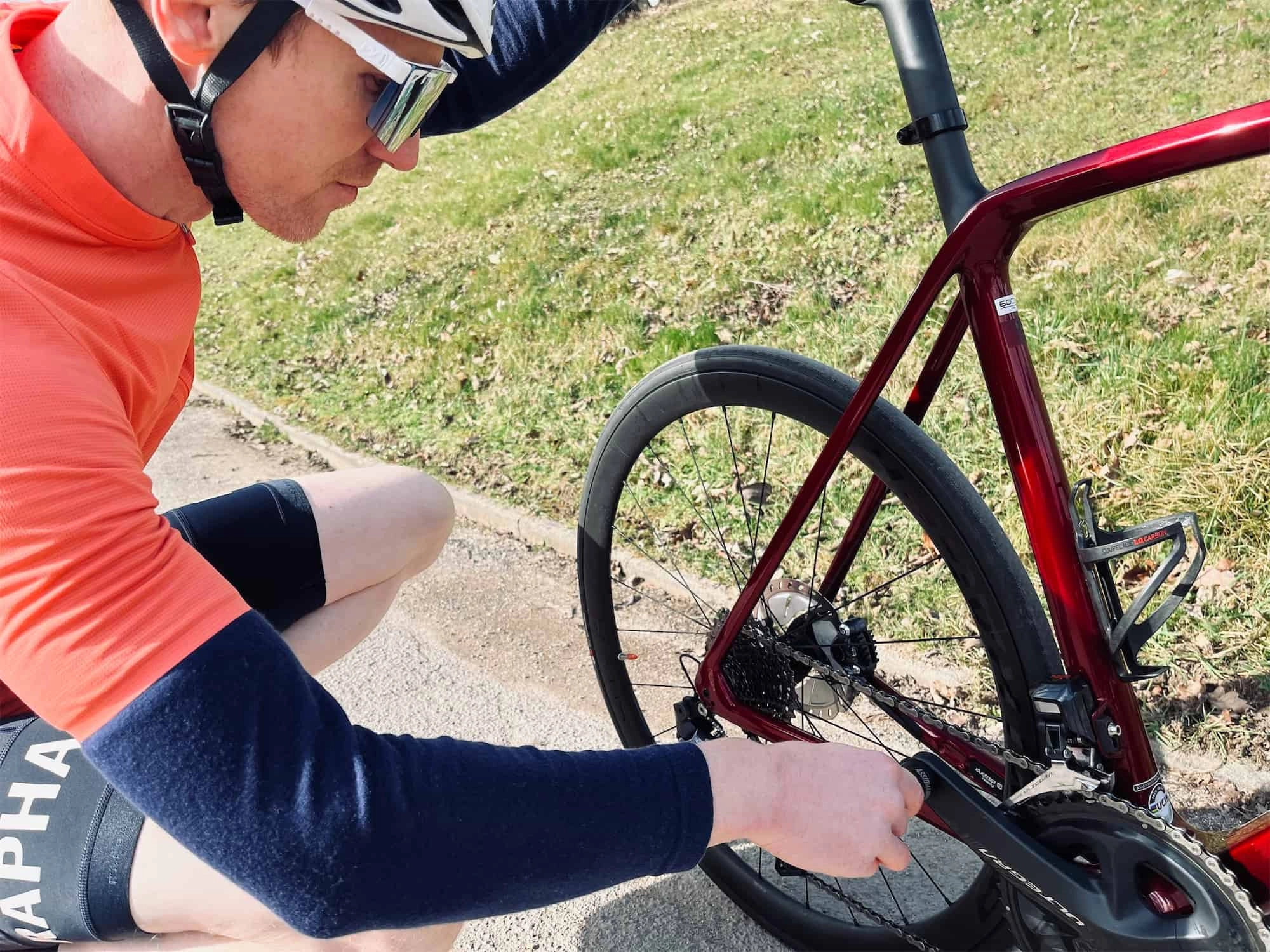 cyclist checking the bike tire
