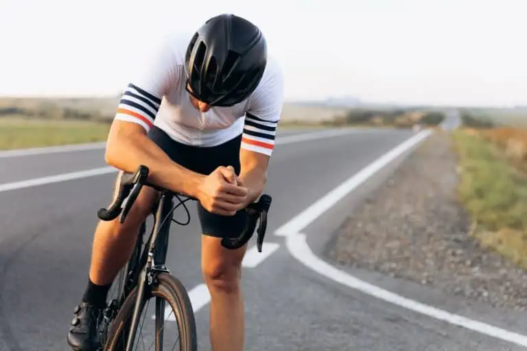 Male cyclist resting after a long ride