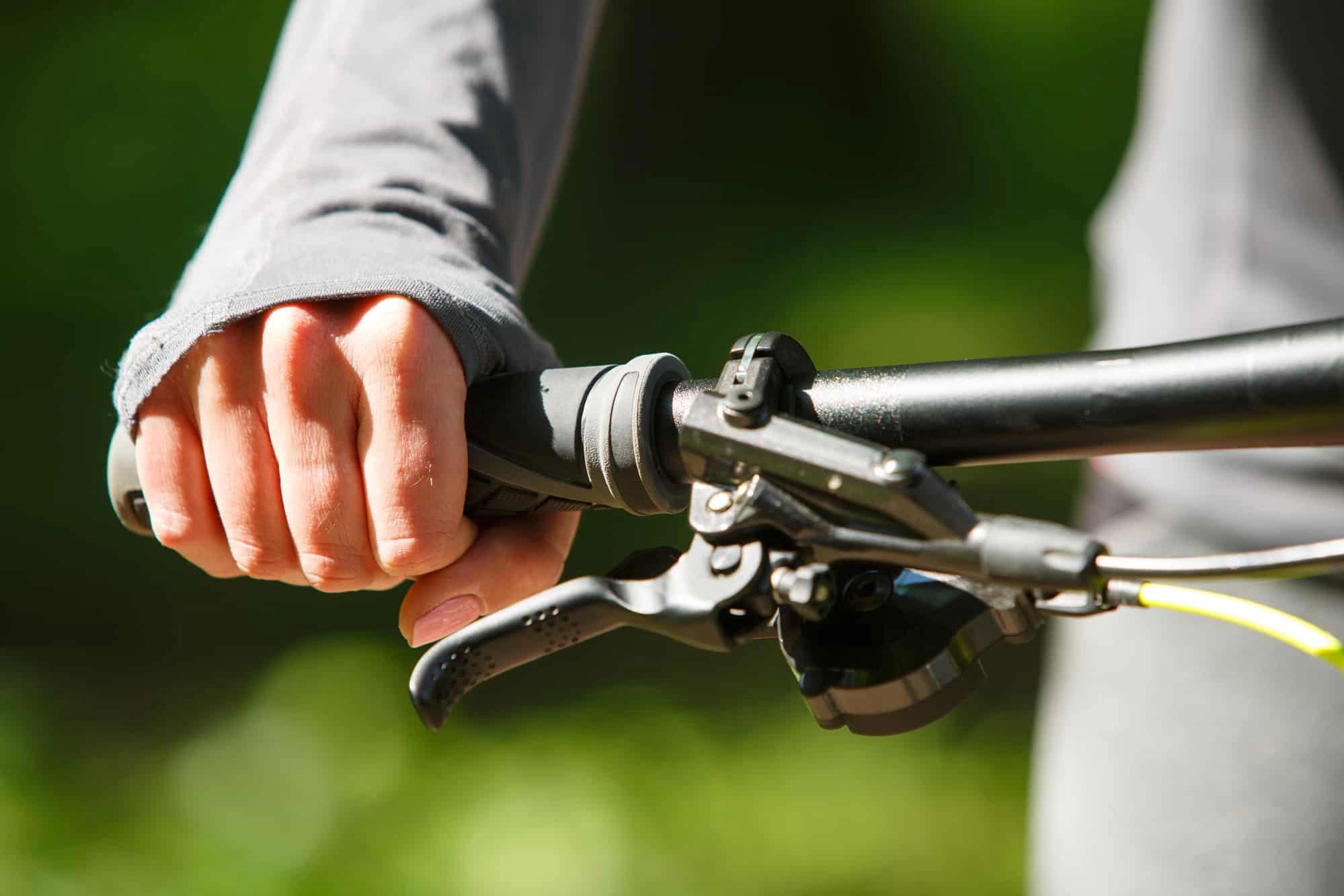 Woman cyclist holding a handlebar