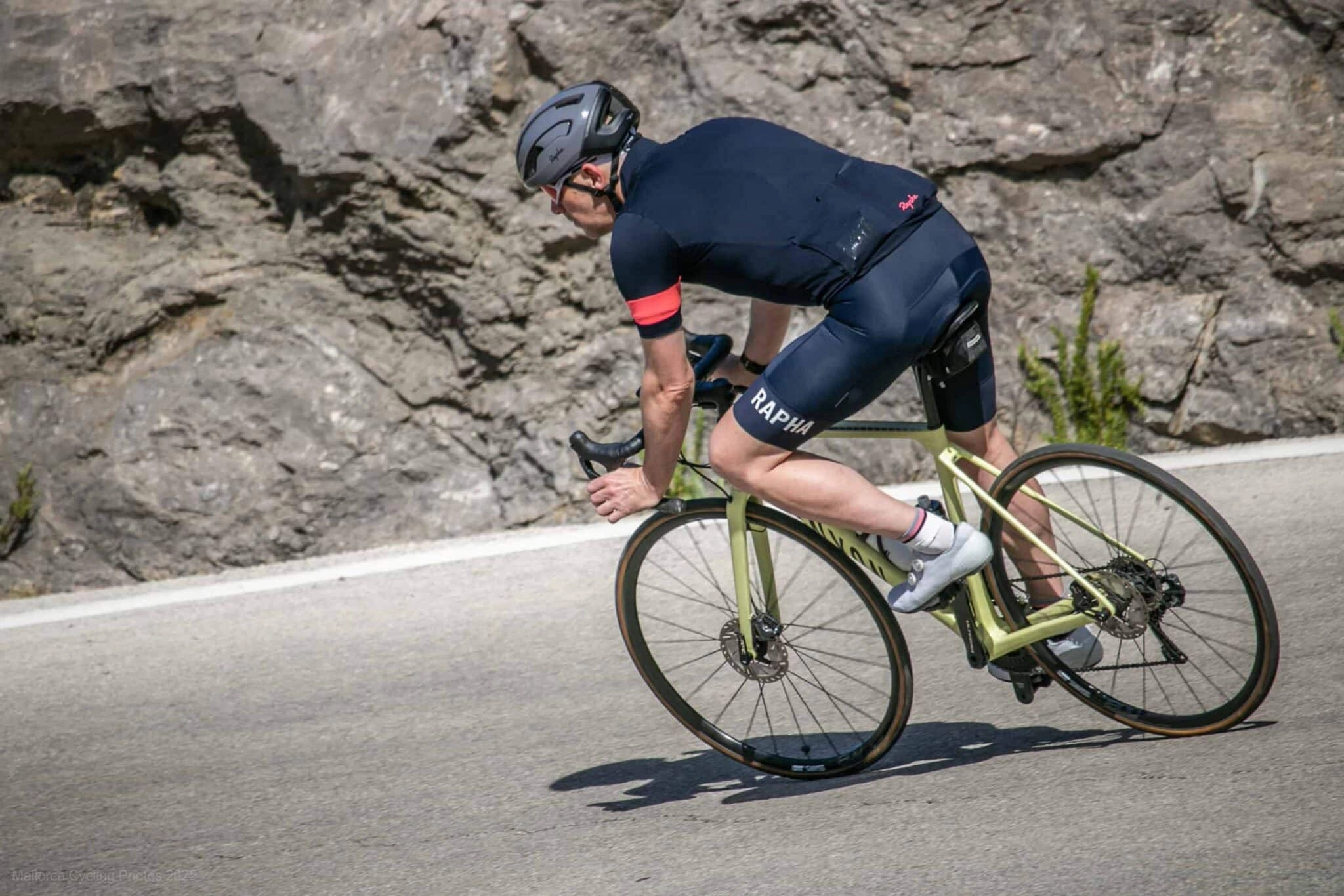 a cyclist riding down Sa Calobra in Mallorca