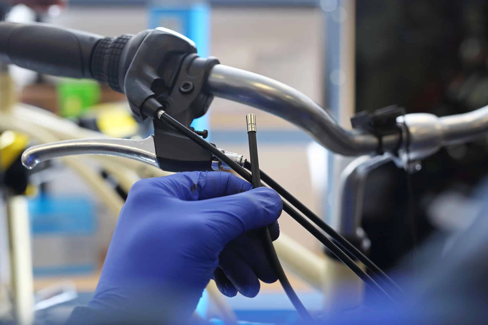 cyclist repairing the brake
