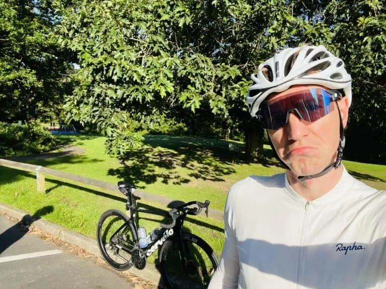 A man is taking a selfie with his bike.