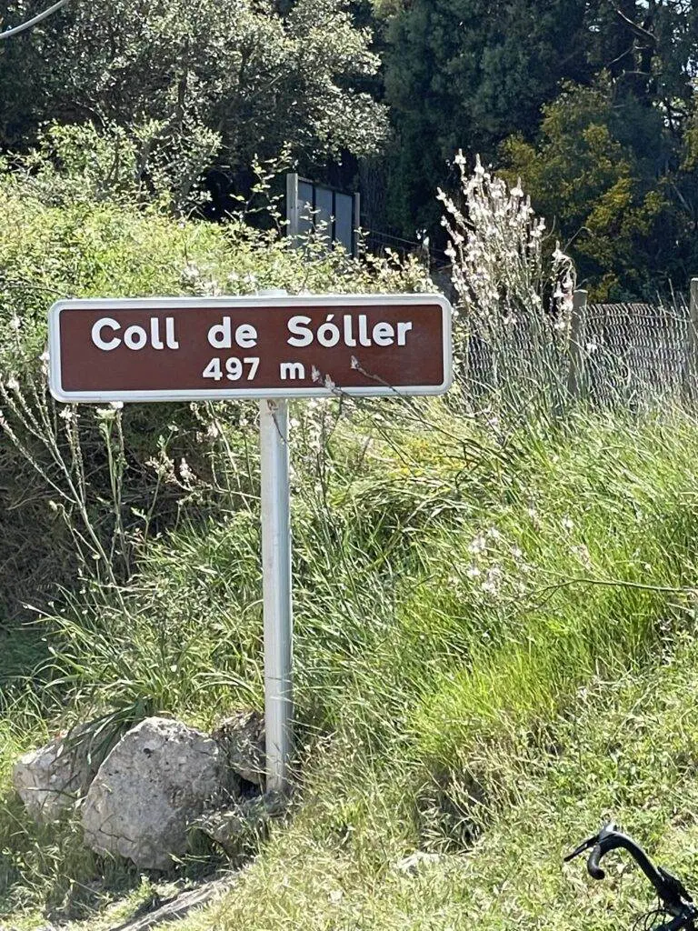 A brown and white sign reads