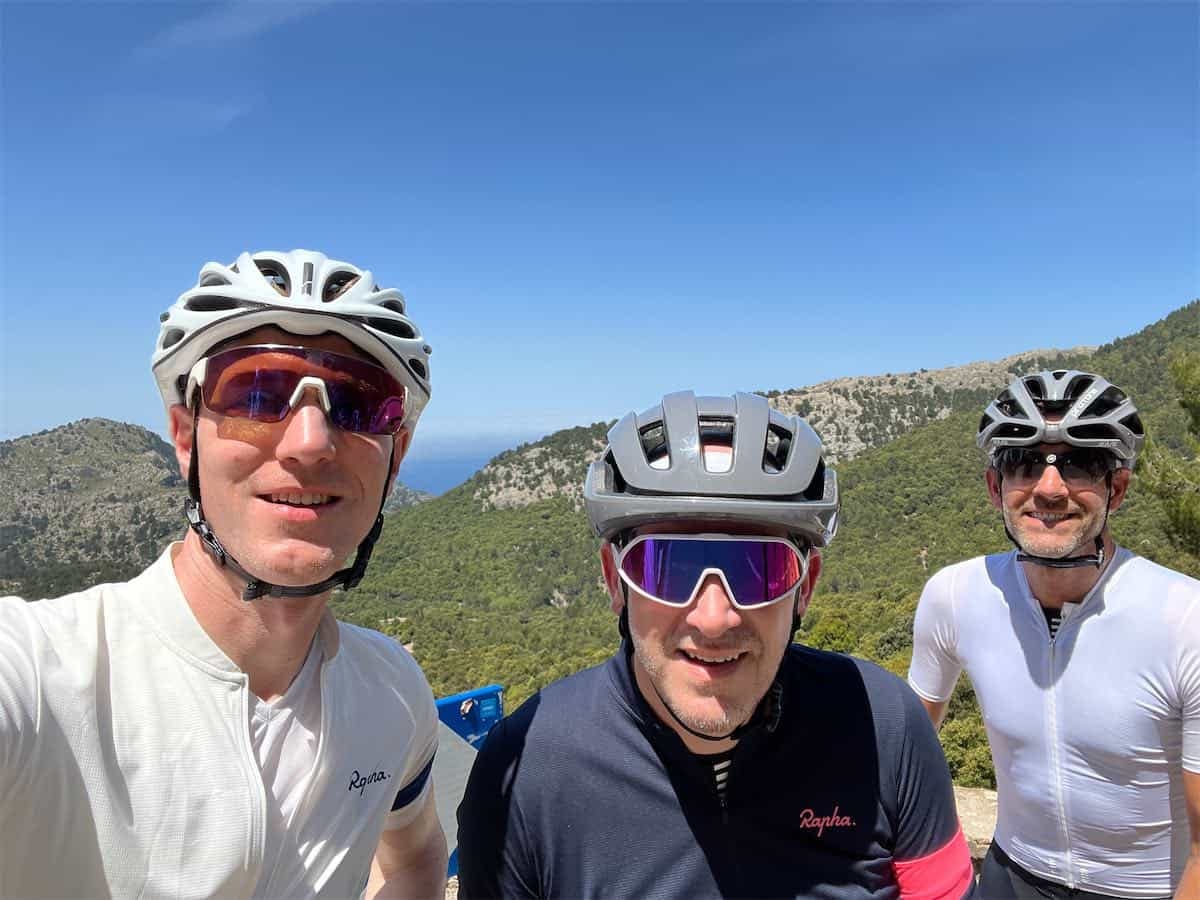 Three road cyclists smiling having cycled to the top of Sa Calobra Mallorca
