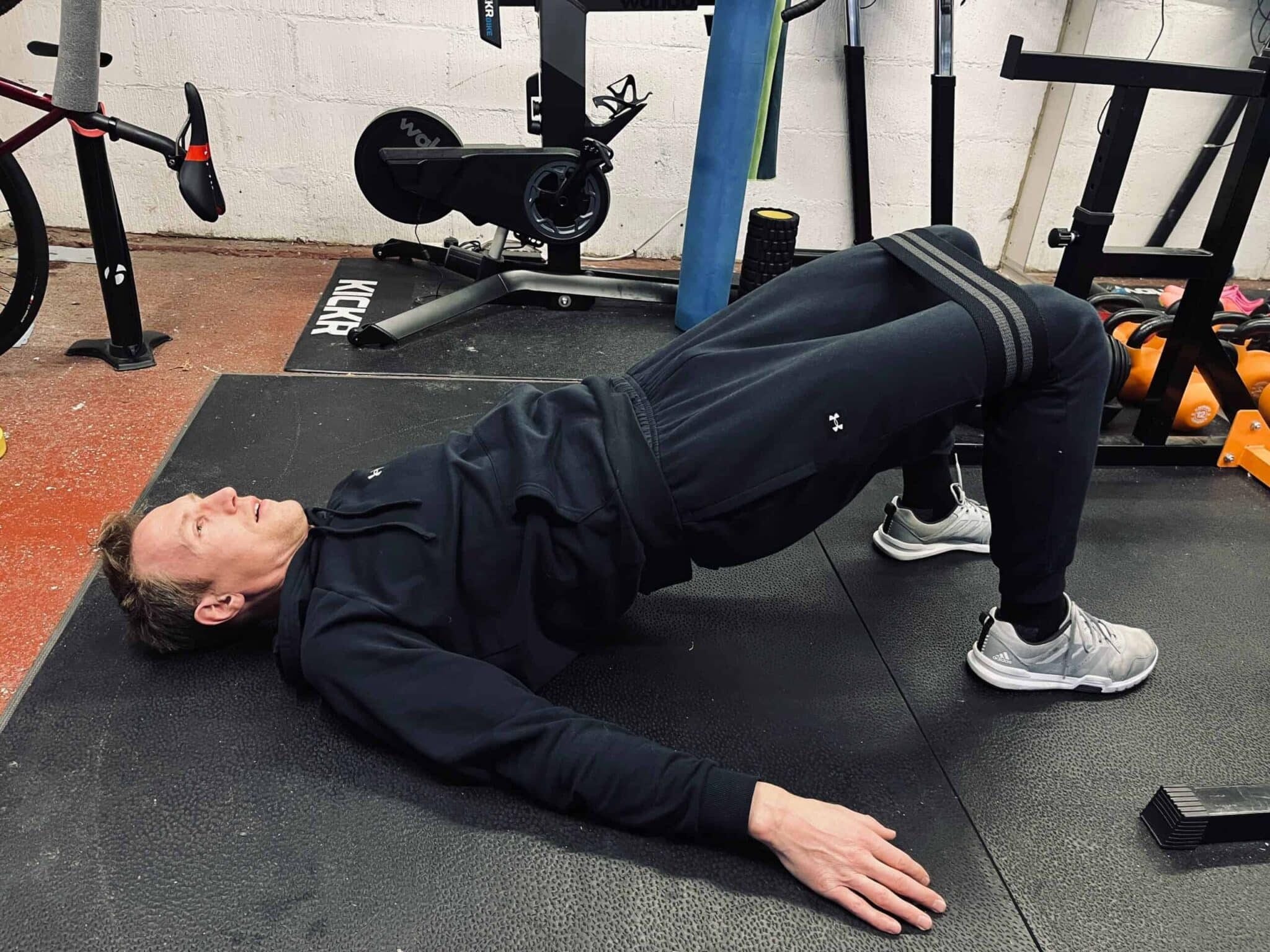cyclist stretching legs using band