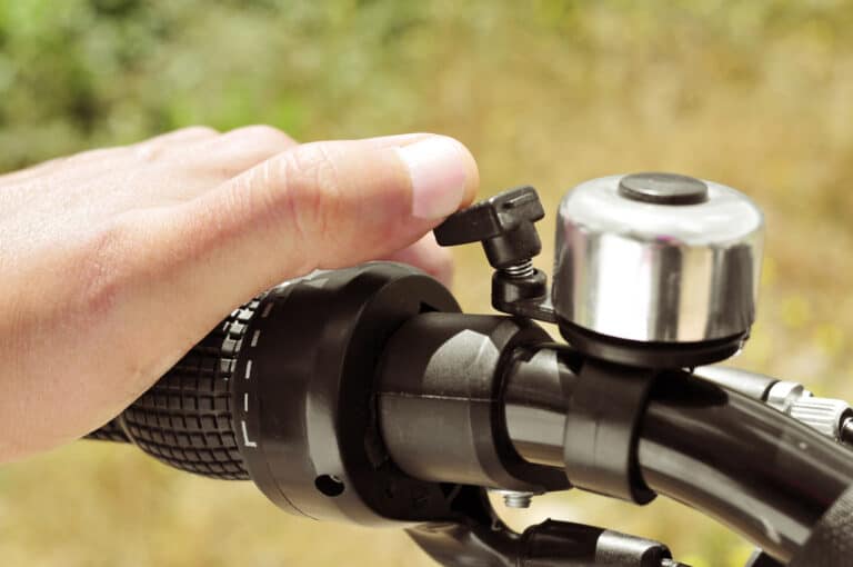 man ringing a bicycle bell
