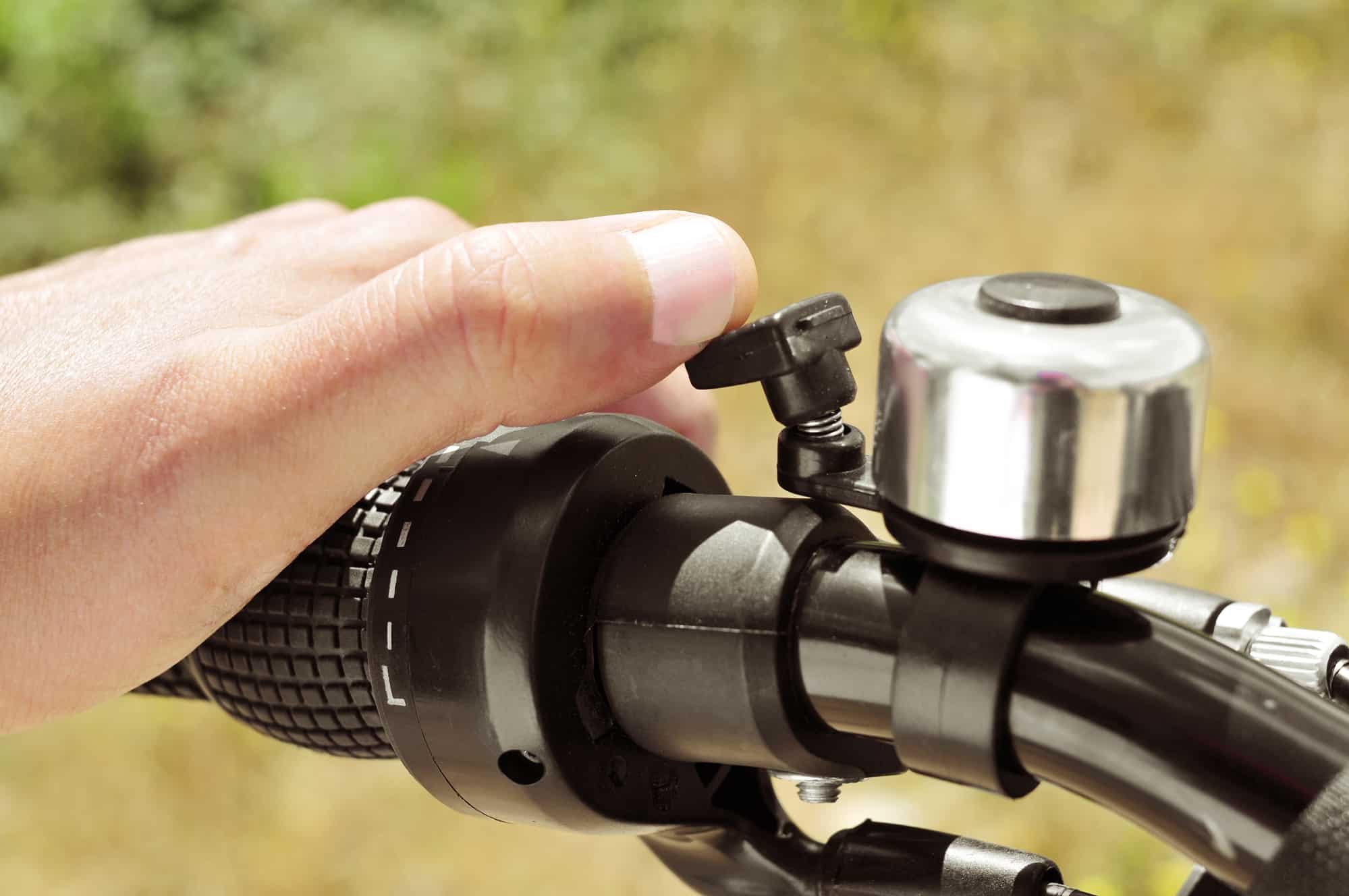 man ringing a bicycle bell